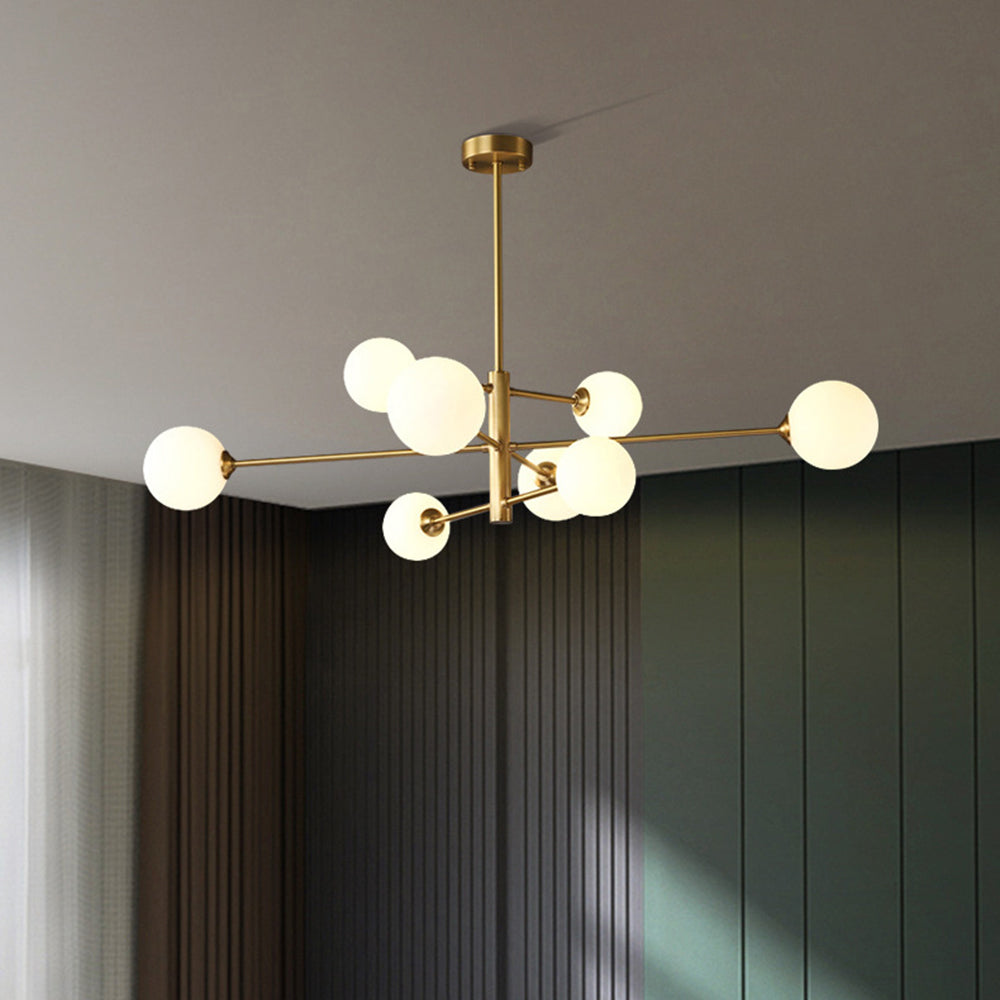 Adjustable modern globe chandelier, gold multi-light pendant for versatile home lighting.