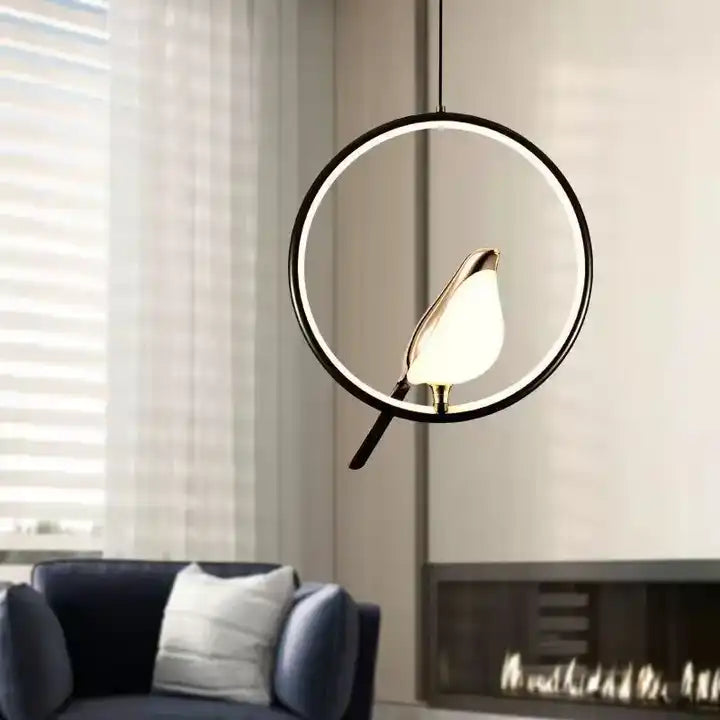 Modern golden bird art pendant light, a unique ceiling lamp that enhances contemporary home aesthetics.
