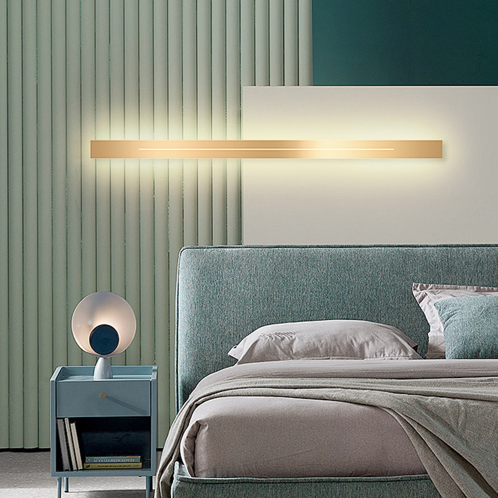 Gold LED wall sconce, modern aesthetic, ideal for dining room ambiance.