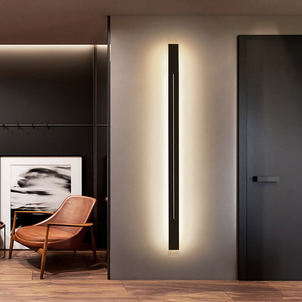 Modern LED wall sconce, gold finish, for stylish hallway lighting.