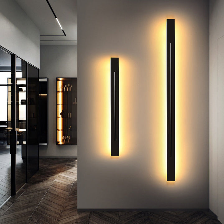 Black modern LED wall light, ideal for a contemporary bedroom.