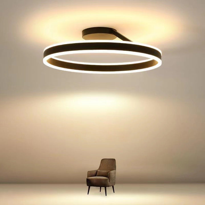 Modern LED ceiling light with minimalist design, ideal for living rooms.