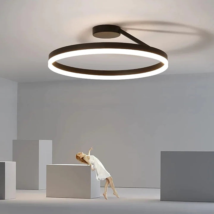 Round LED ceiling light, contemporary and energy-efficient for kitchens or hallways.