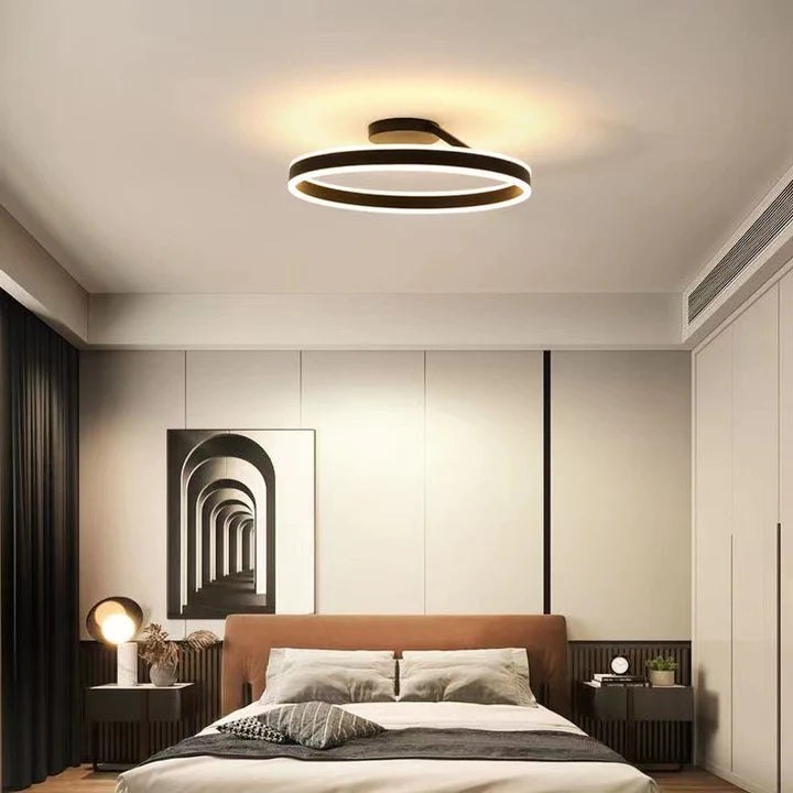 Sleek contemporary LED ceiling lamp, energy-efficient for bedrooms.