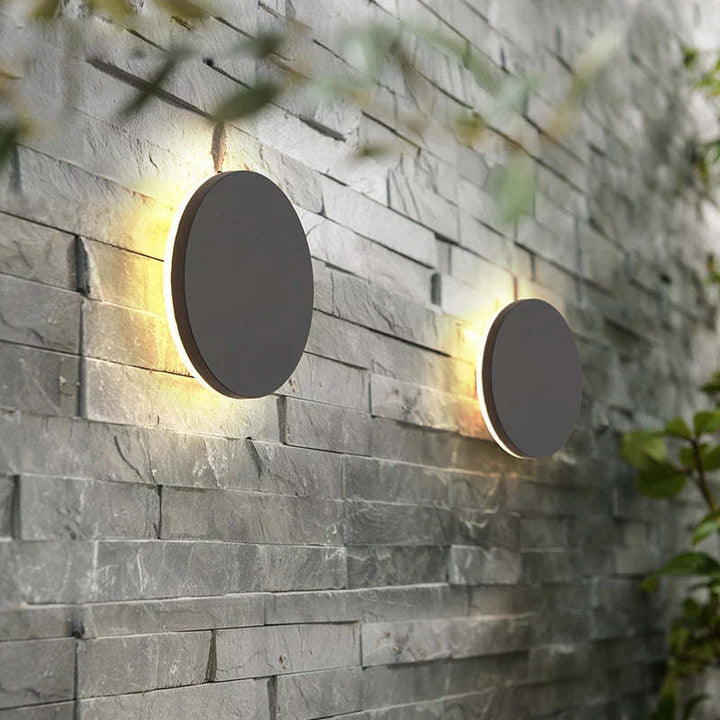 Sleek LED wall lamp with motion sensor for garden & patio security lighting.
