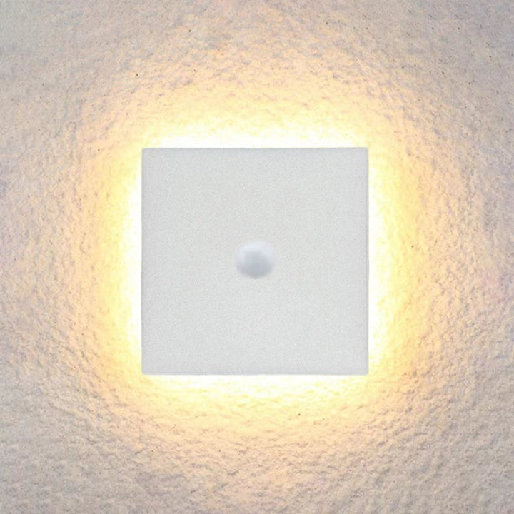 Energy-efficient LED outdoor wall light with motion sensor for smart homes.