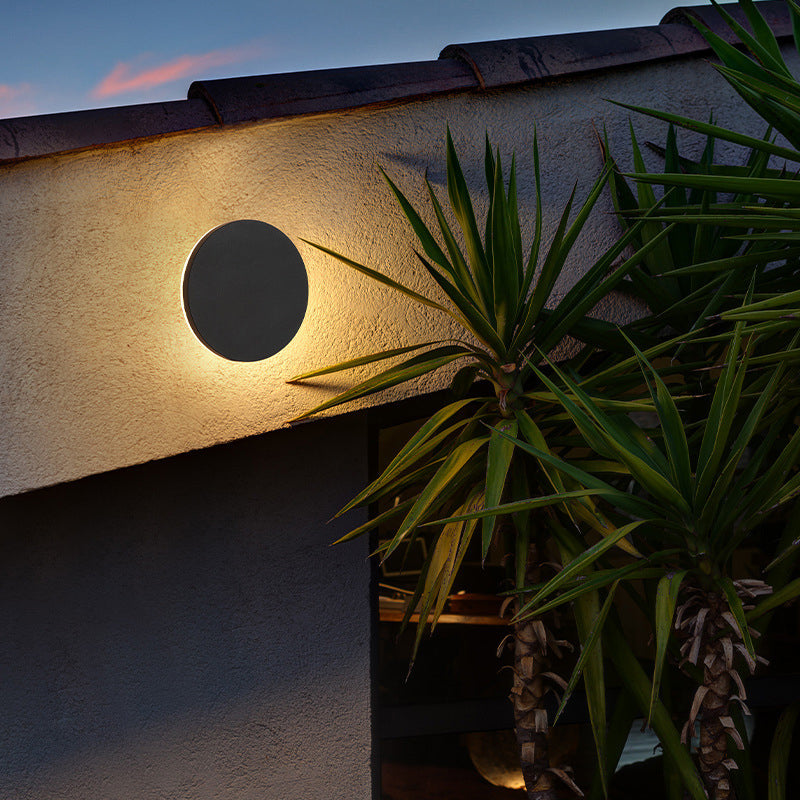 Outdoor LED wall lamp with motion sensor, perfect for smart garden lighting.