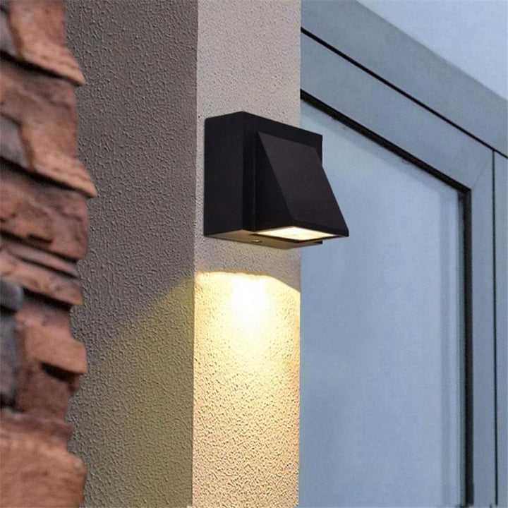 Sleek modern LED outdoor wall lamp sconce; ideal architectural lighting for contemporary homes.