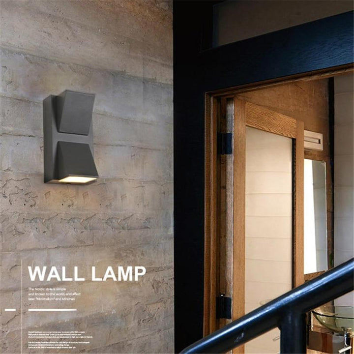 Energy-efficient modern LED outdoor wall lamp, bright weatherproof sconce for exterior home lighting.