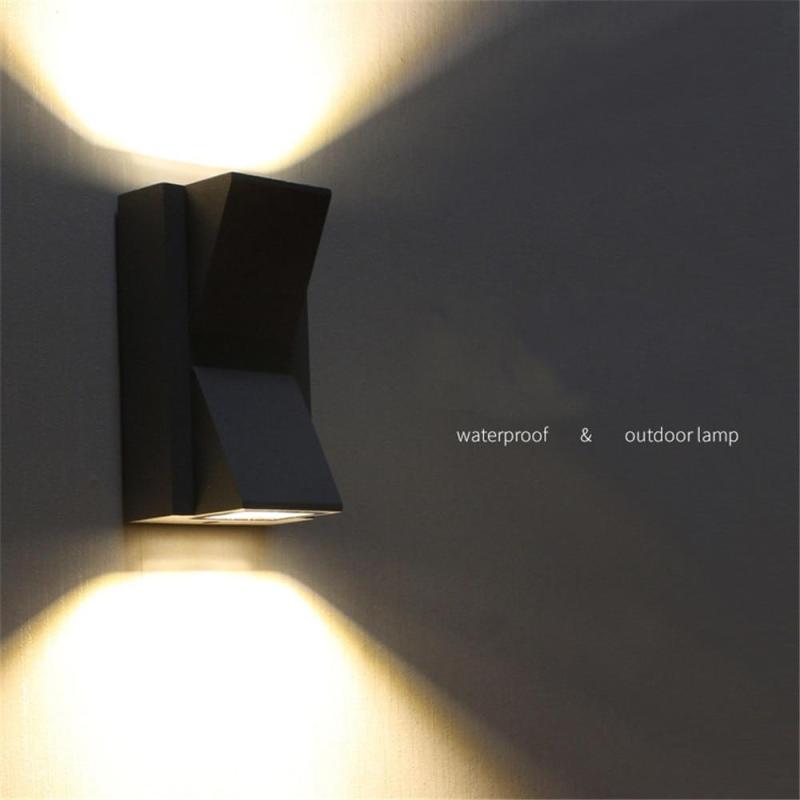 Durable modern LED outdoor wall light sconce, hardwired for reliable, stylish exterior illumination.