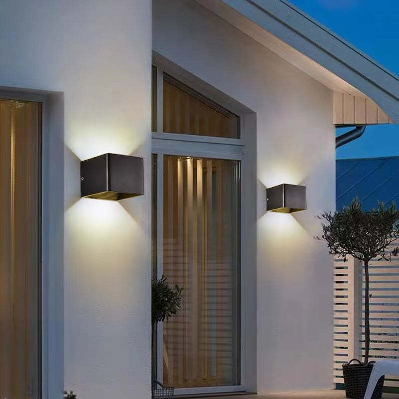 Up/down modern LED outdoor wall light, versatile for both exterior and interior contemporary spaces.