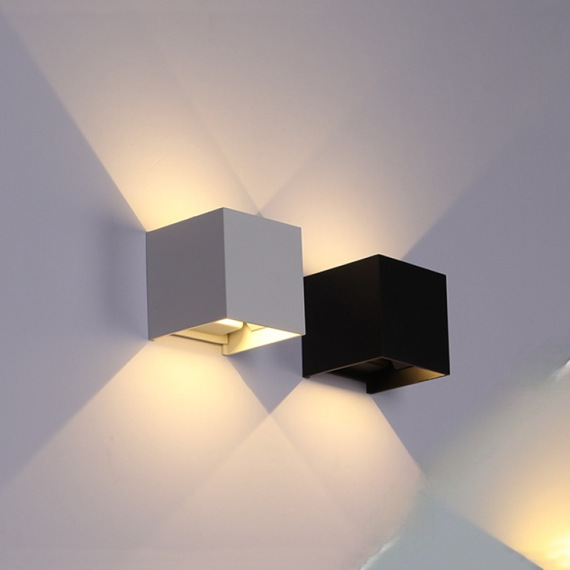 Black LED outdoor wall sconce, energy-saving, modern design complements any home's exterior.