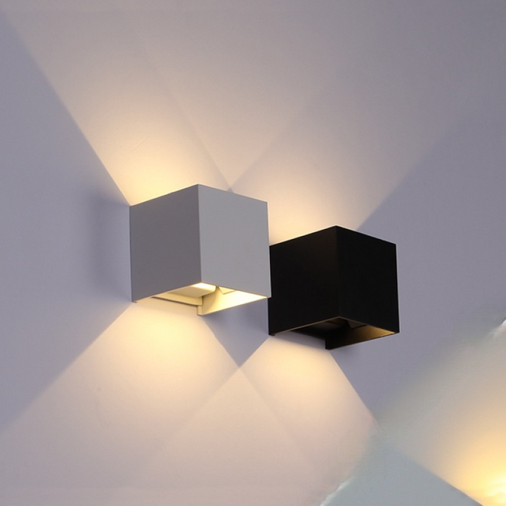Black LED outdoor wall sconce, energy-saving, modern design complements any home's exterior.
