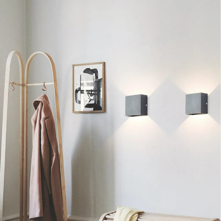 Modern waterproof LED outdoor light, stylish black finish, ideal for patios, porches, and entryways.