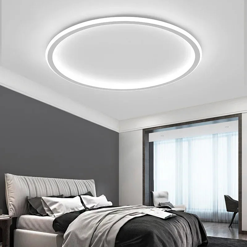 View of a modern Scandinavian LED flush mount ceiling light, round shape, crafted with metal and glass.