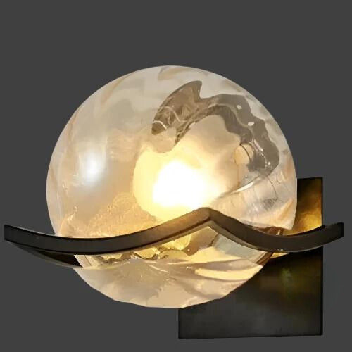 Contemporary glass LED wall light, offering elegant and energy-efficient home ambiance.