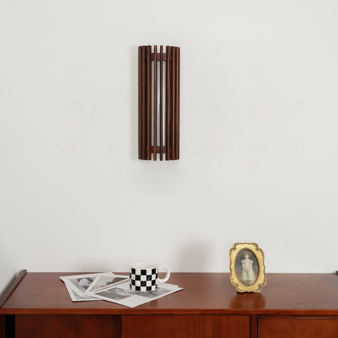 Designer indoor LED wall light, featuring elegant wood and a clear acrylic diffuser.