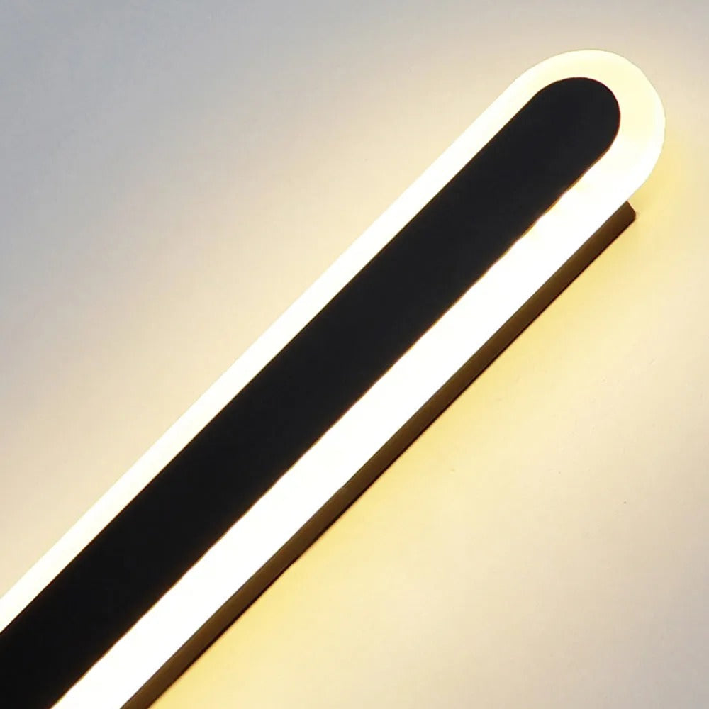 Modern linear LED outdoor wall lamp, black finish, sleek exterior light fixture.