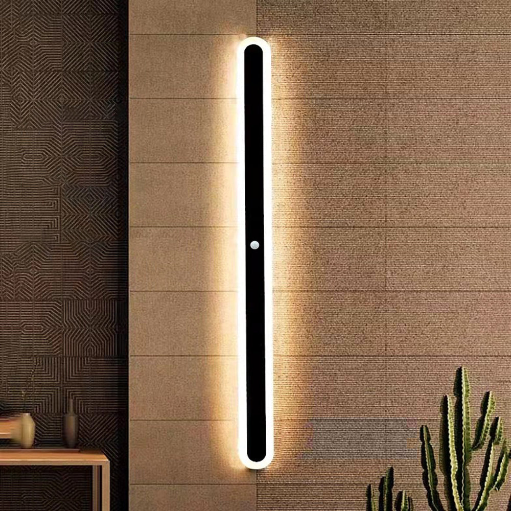 Minimalist modern linear outdoor wall lamp, black finish, contemporary exterior lighting accent.
