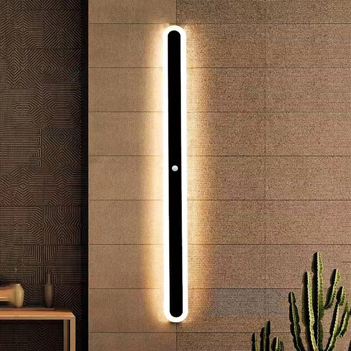 Minimalist modern linear outdoor wall lamp, black finish, contemporary exterior lighting accent.