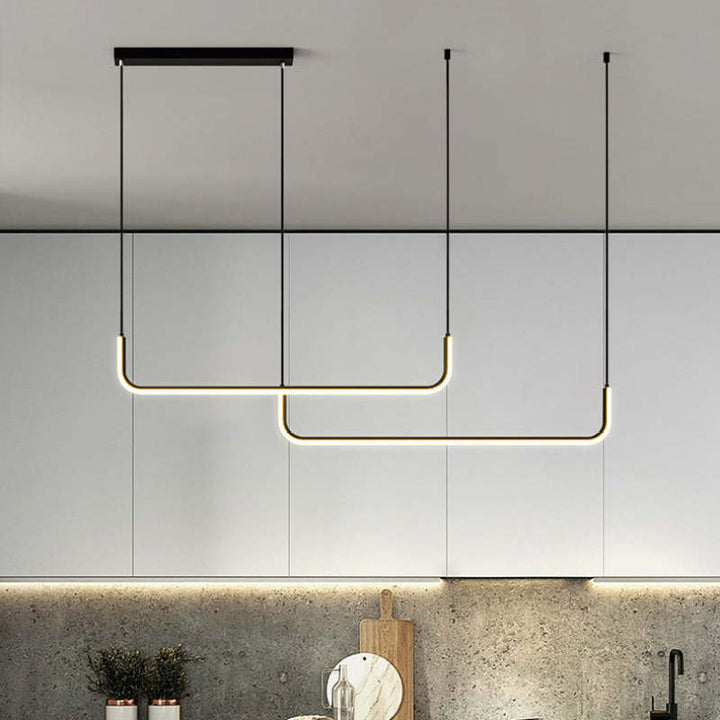 Sleek modern linear LED pendant light enhancing the aesthetic of a minimalist dining or living space.