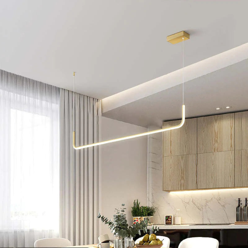 Stylish linear LED pendant light for modern homes, perfect for dining rooms & kitchen islands.