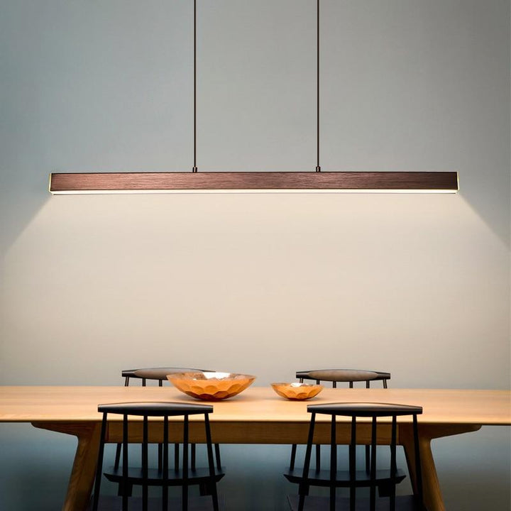 Contemporary brown linear pendant, dimmable for adjustable dining room lighting.