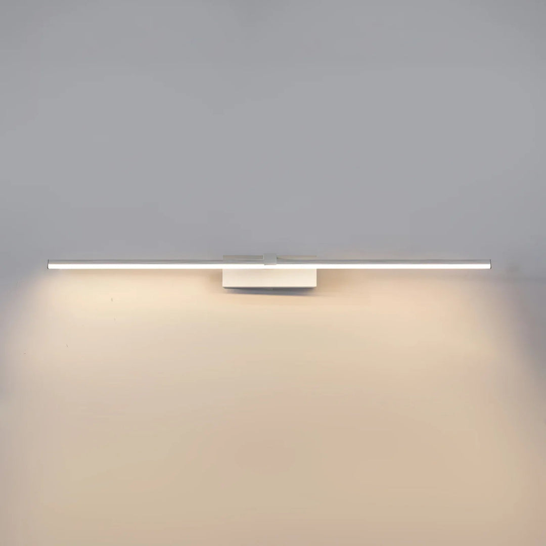 Gold linear LED light, hardwired for contemporary bathroom or vanity area.