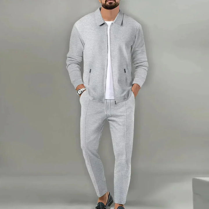 Versatile men's slim fit two-piece suit. Elegant blazer & trousers for business, wedding, or party wear. Sharp style.