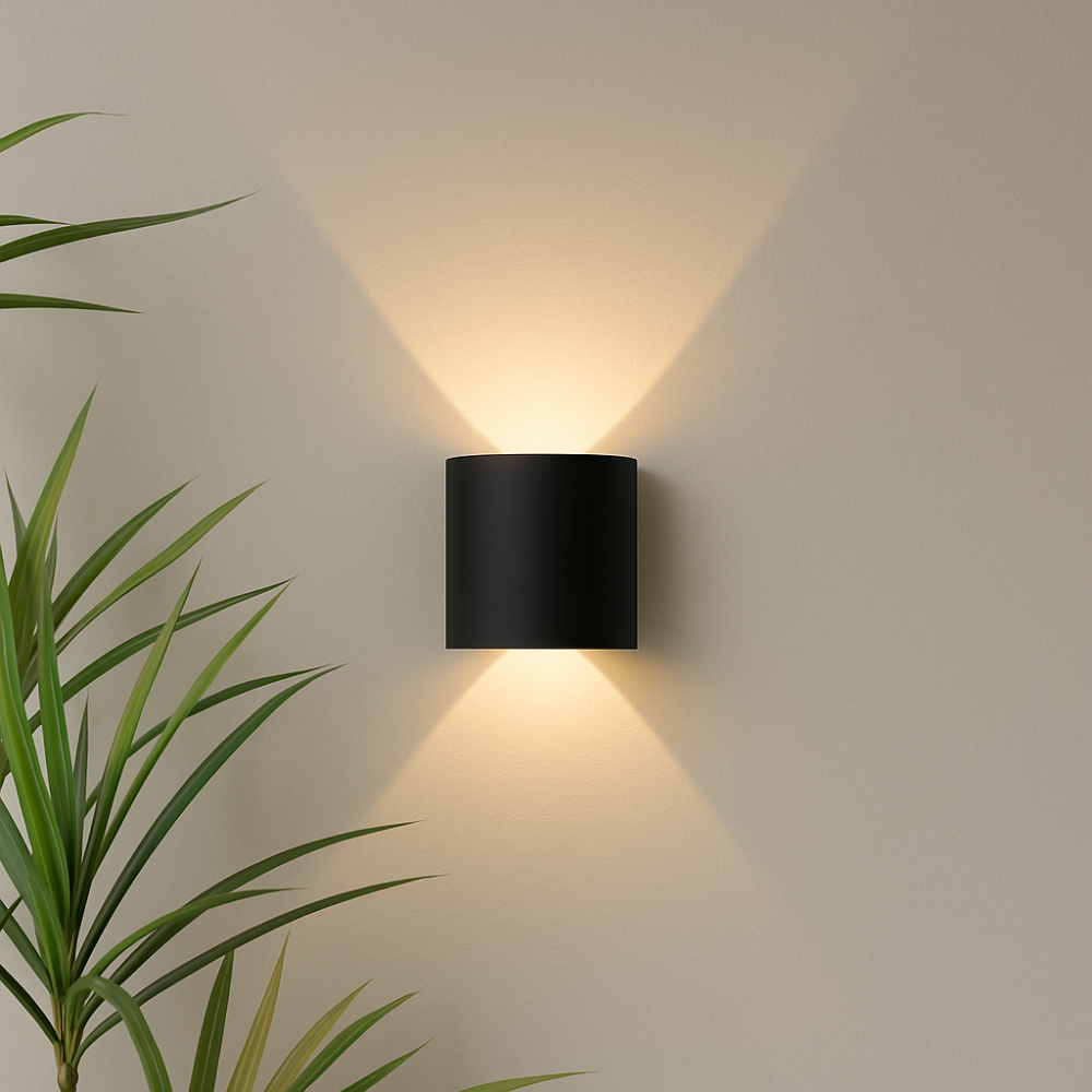 Modern minimalist LED wall light in black finish for indoor and outdoor use.