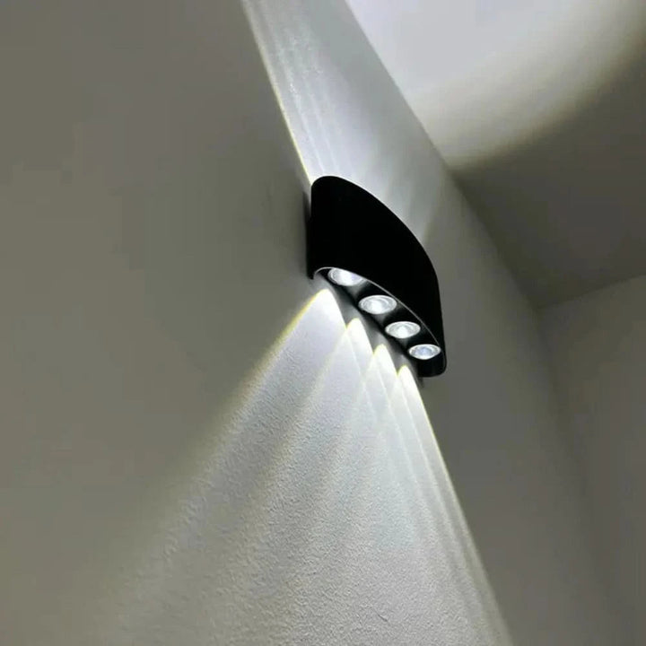 Sleek LED wall fixture with minimalist design, perfect for contemporary home decor.