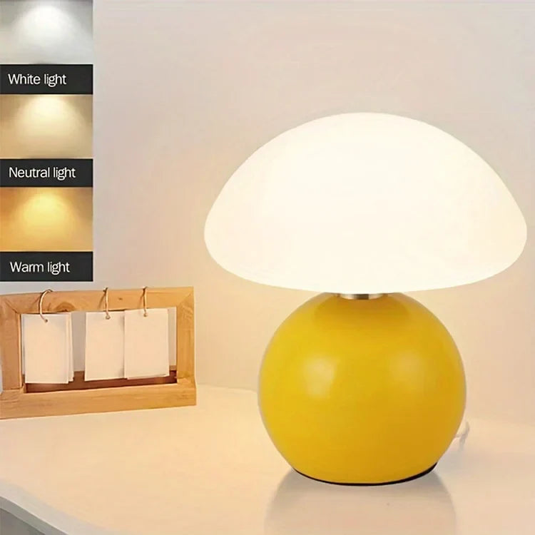 Modern LED mushroom table lamp, adjustable colors, unique home decor lighting with sleek design.