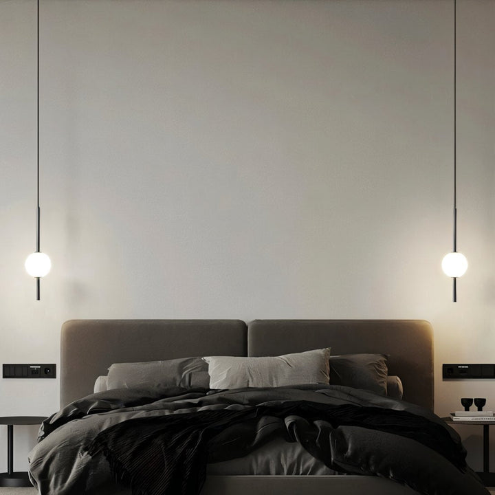 Sleek black & brass modern Nordic LED pendant light, providing stylish and efficient home illumination.