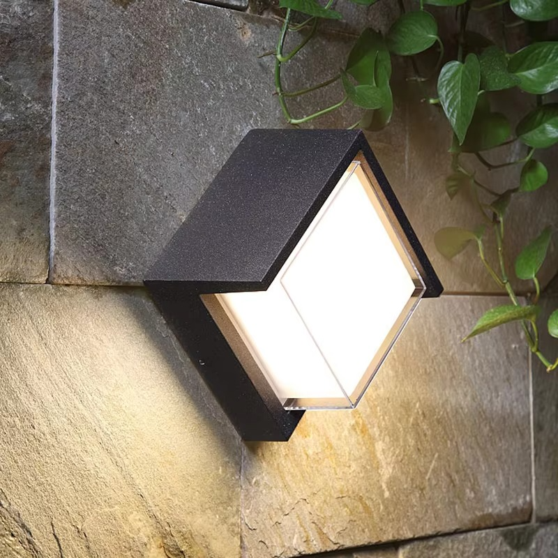 Energy-efficient modern LED outdoor wall lamp. Motion sensor light for exterior, contemporary garden design.