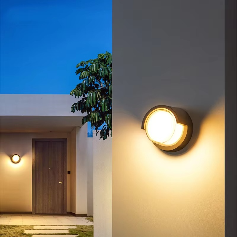 Exterior modern wall lamp with motion sensor. Weatherproof LED lighting for garden, patio, security.