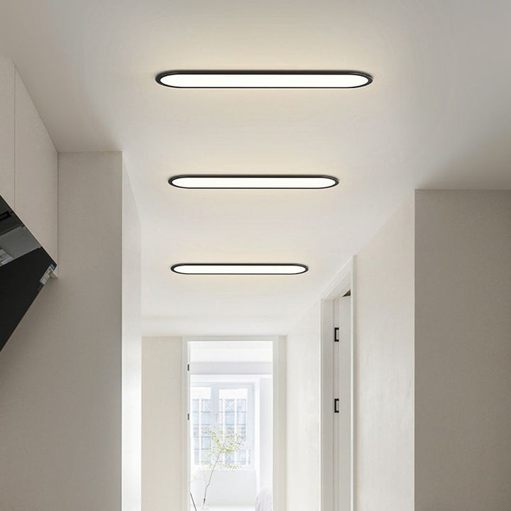Dining room modern oval LED flush mount ceiling light, energy-efficient & stylish decor.