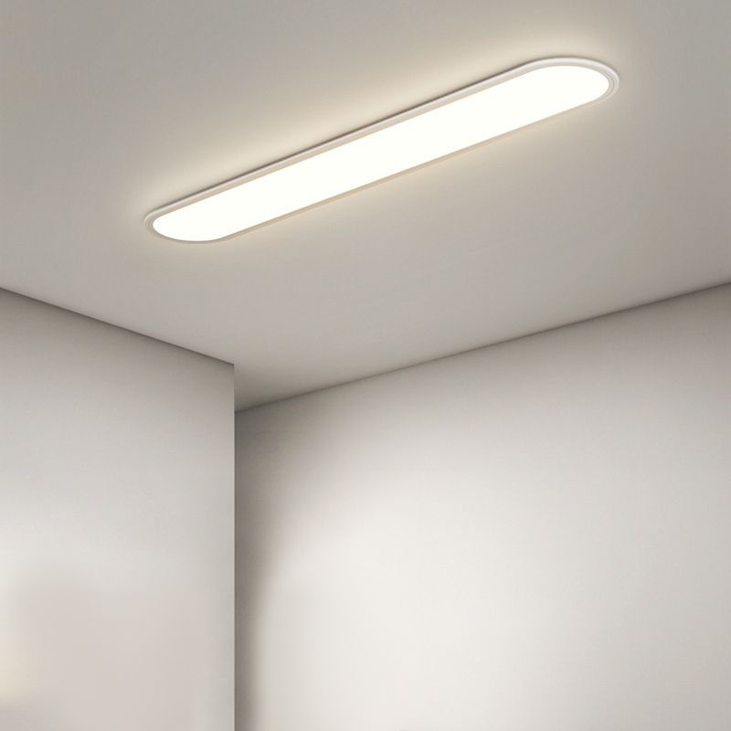 Sleek oval LED flush mount ceiling lamp, modern lighting for living rooms & dining areas.