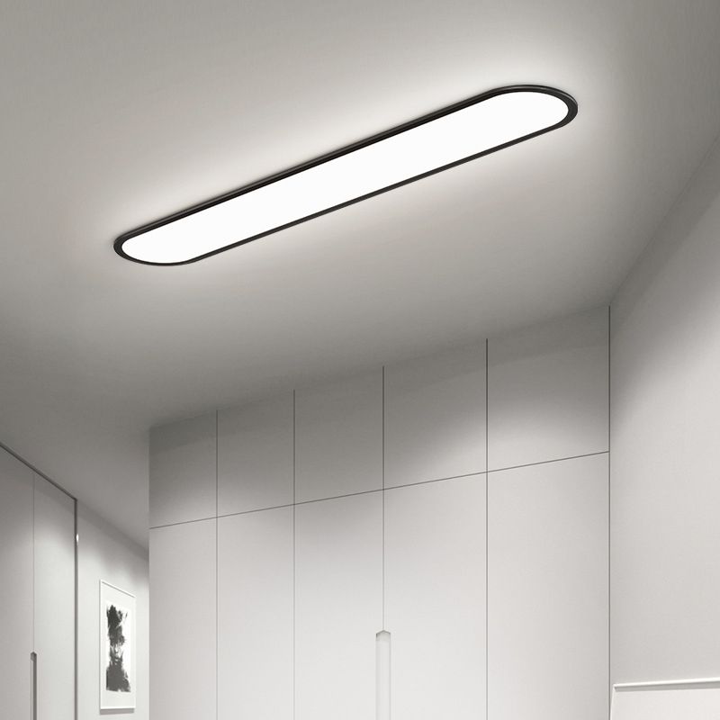 Space-saving modern oval LED flush mount light, ideal for bedrooms & contemporary decor.
