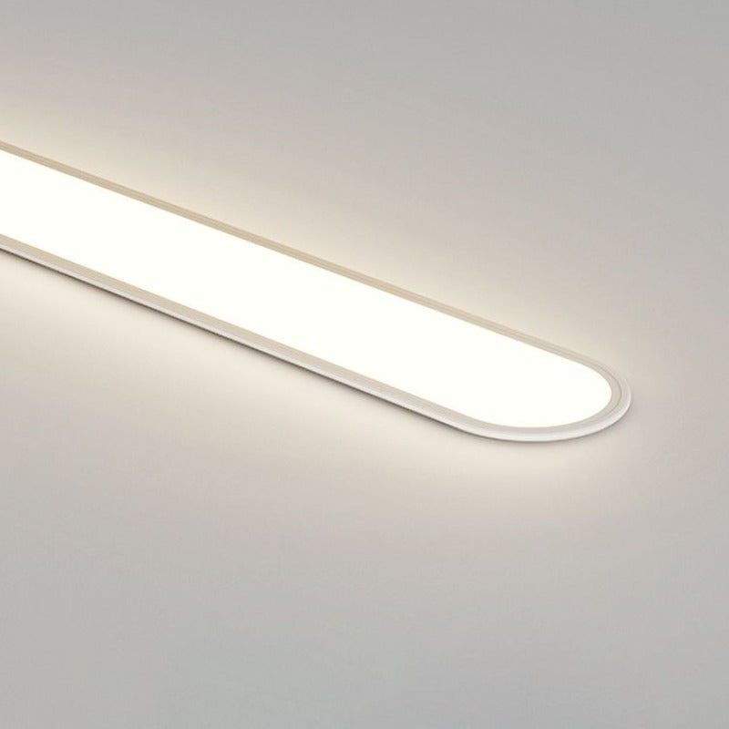 Stylish oval LED flush mount light, enhancing modern living room and bedroom interiors.