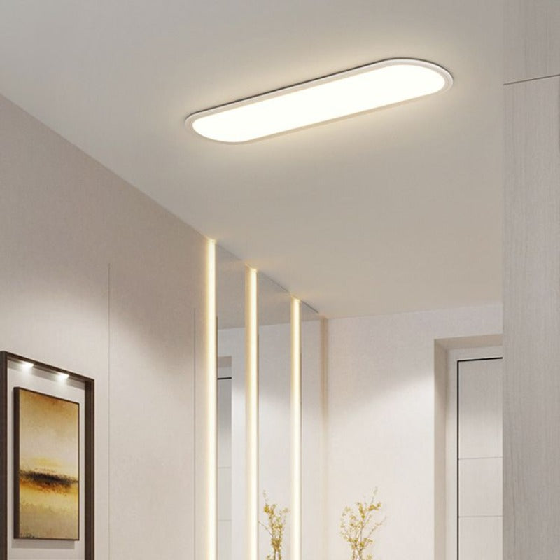 Bright, even light from a modern oval LED flush mount ceiling lamp with sleek design.