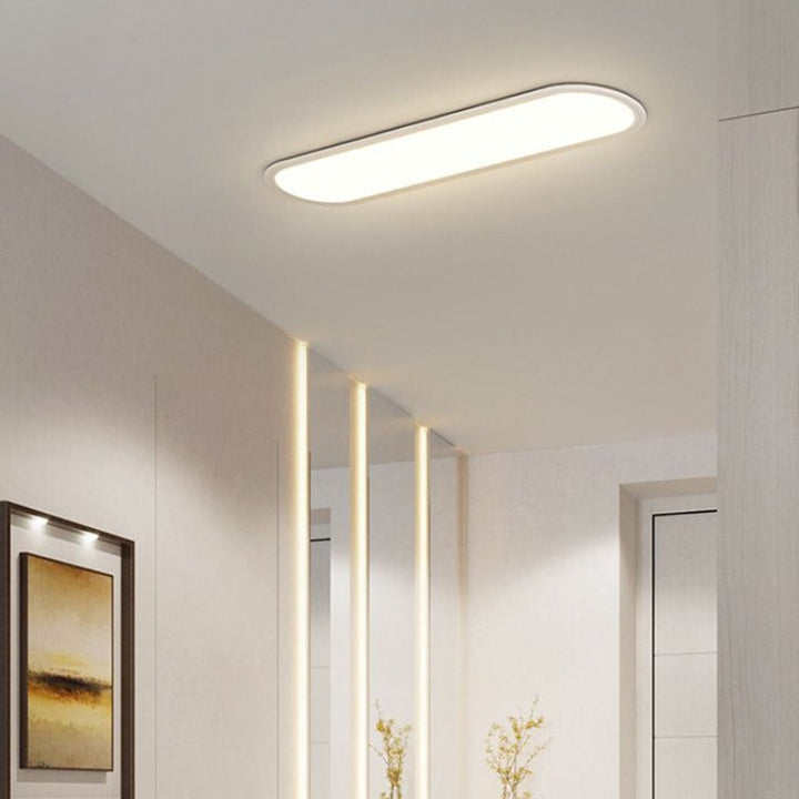 Bright, even light from a modern oval LED flush mount ceiling lamp with sleek design.
