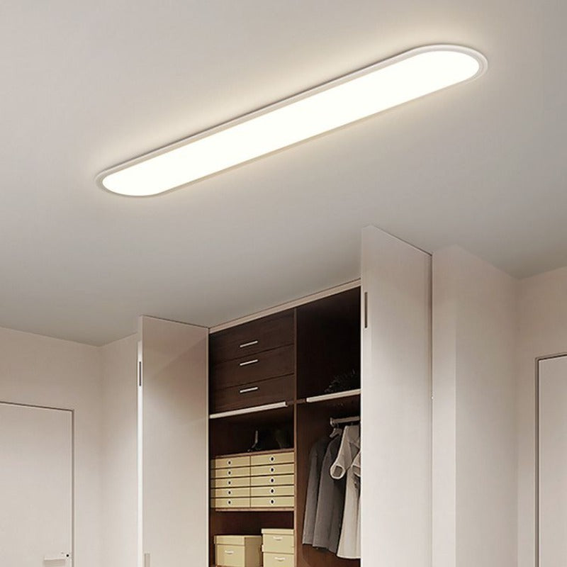 Modern LED oval flush mount ceiling light, contemporary home illumination, space-saving.