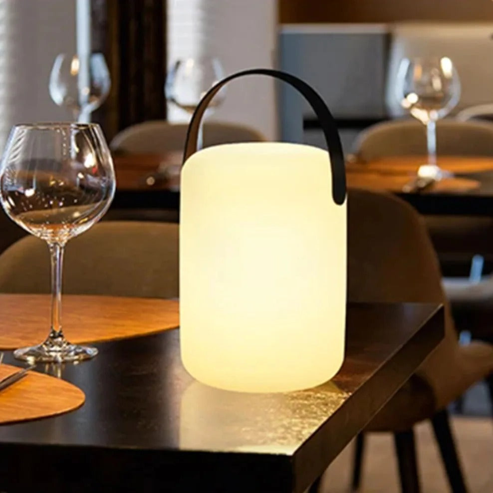 Sleek modern waterproof lamp, cordless & remote-controlled for versatile ambient lighting.