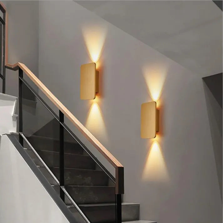 Ambient rectangular LED wall lamp, modern, creates warm glow in bedrooms.