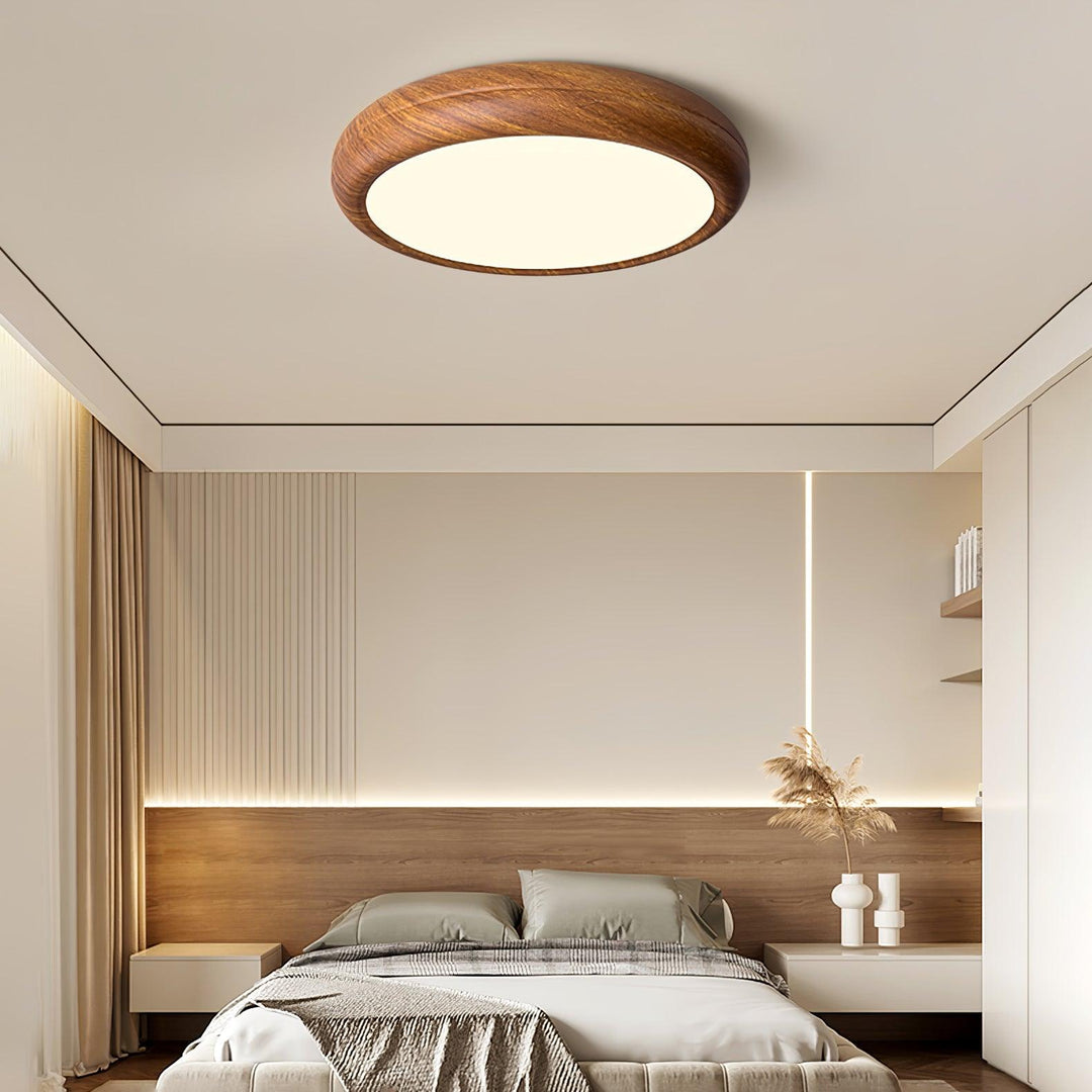 Contemporary LED round ceiling fixture, wood grain finish, flush mount design.