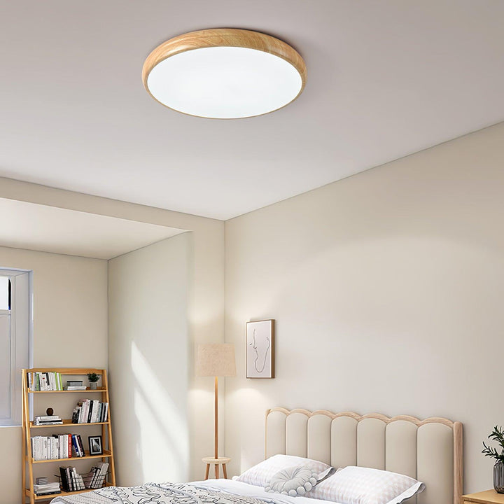 Contemporary round LED ceiling fixture, flush mount, stylish wood grain details.