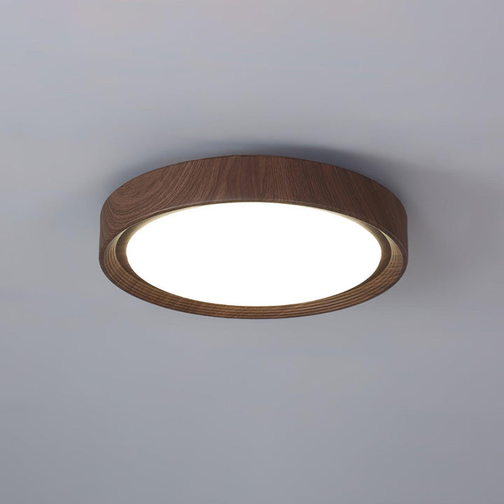 Wood grain modern LED flush mount ceiling light, round, for contemporary interiors.