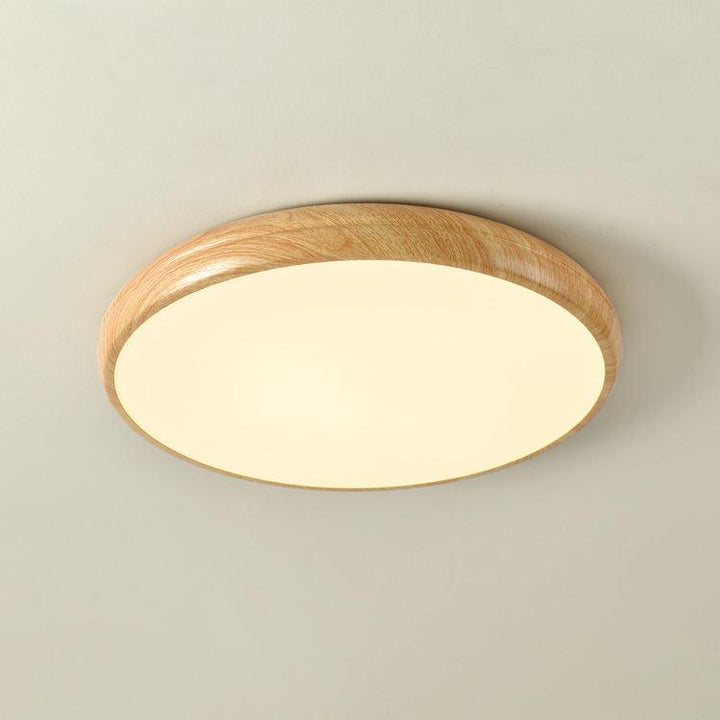 Round LED ceiling light, modern, wood grain, flush mount, offers customizable light.