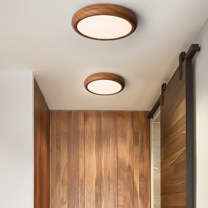 Sleek round LED ceiling light, flush mount, wood grain, ideal for contemporary homes.