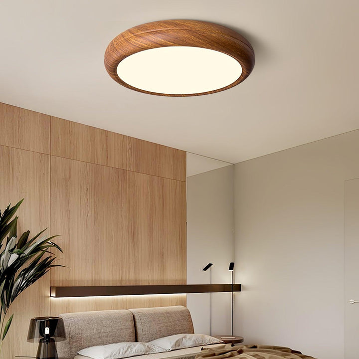 Modern interior LED ceiling fixture, round, dimmable, with wood grain detail.